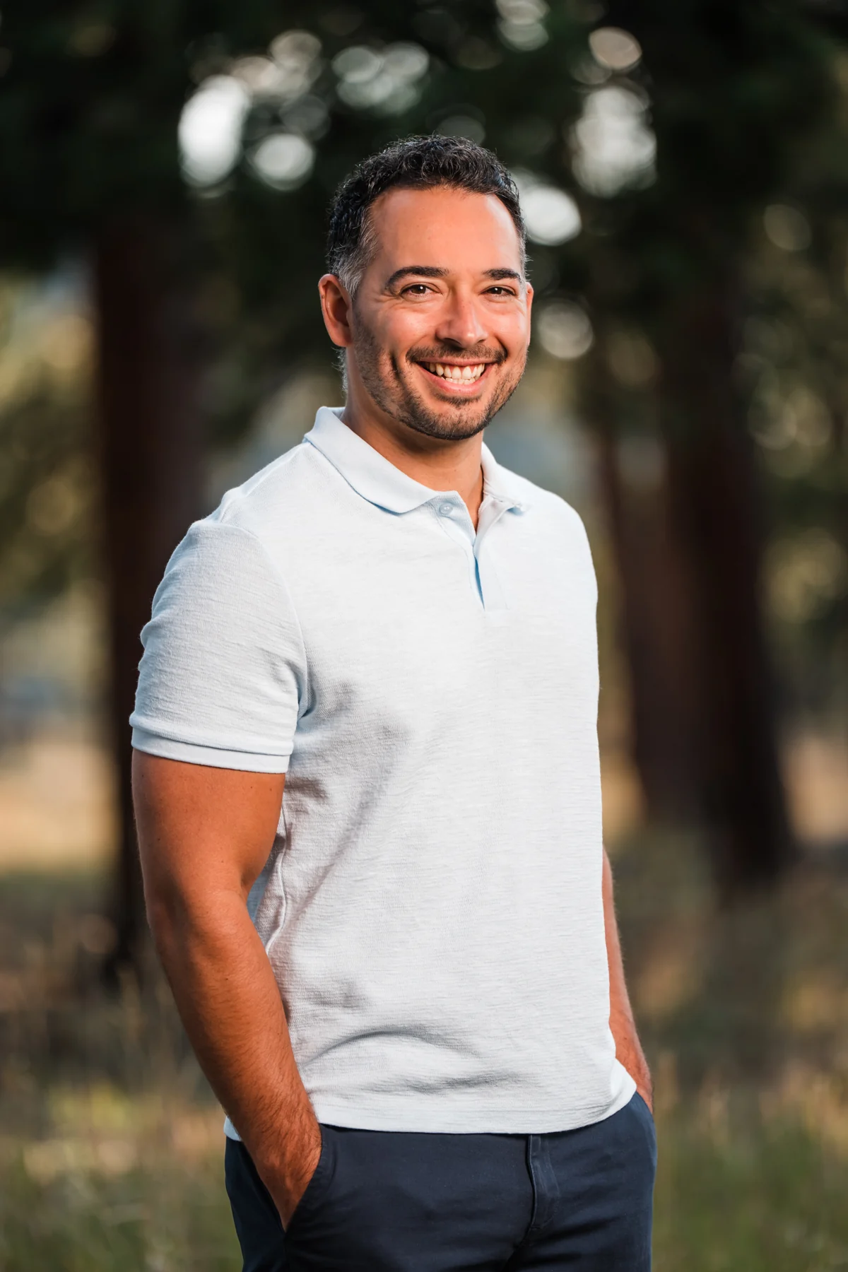 Caleb Davis smiling outdoors in Colorado